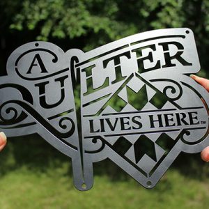 03-Joe-Diaz-A-Quilter-Lives-Here-Logo-Metal-Cut-Sign