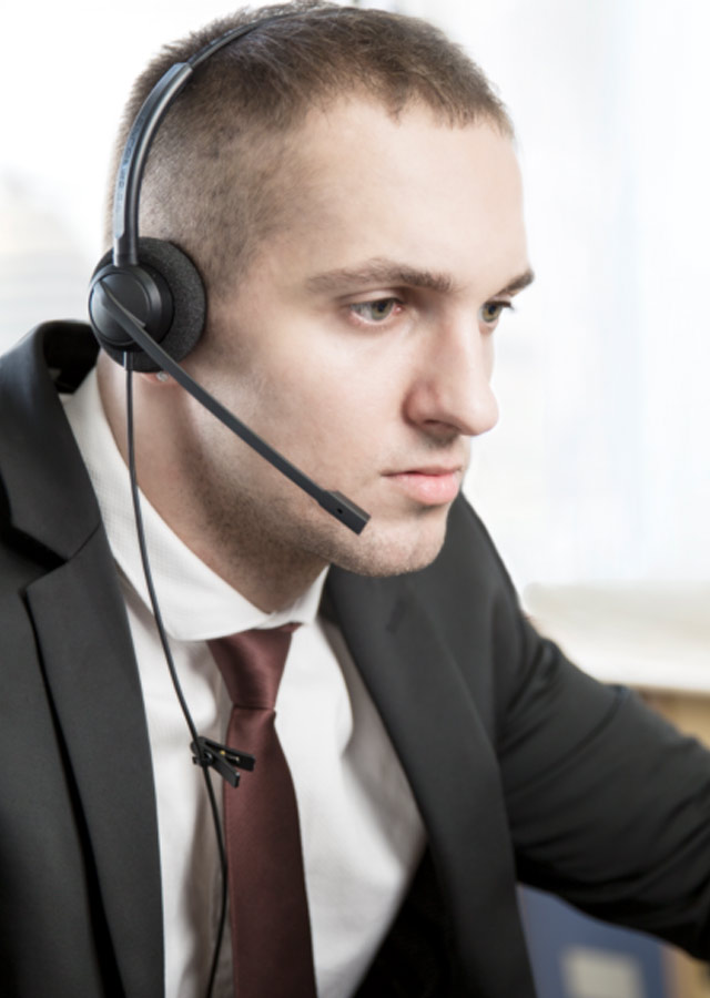 Man concentrating at work with Addasound Crystal SR2732 USB headset