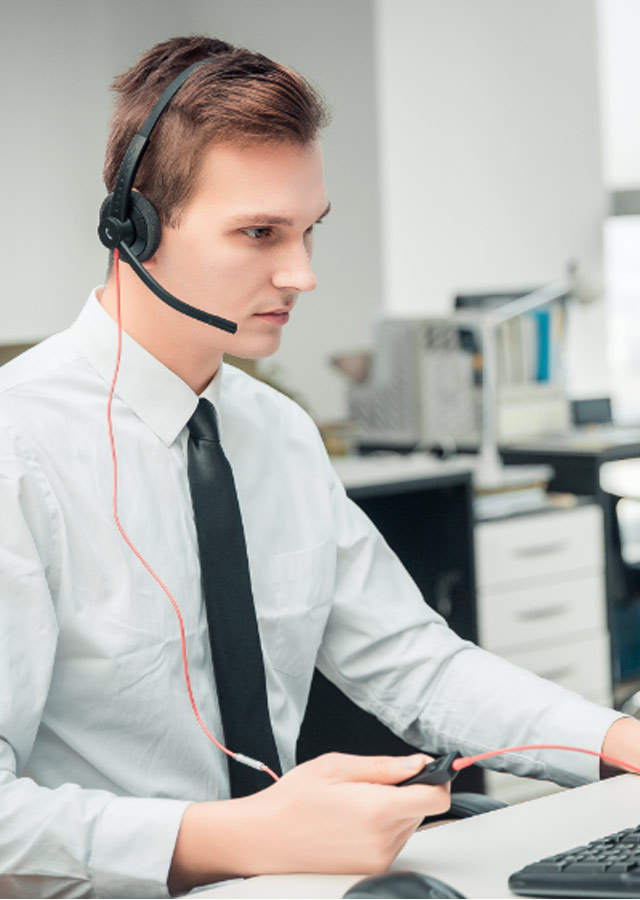 Male office worker pressing the call controller button of EPIC 302 USB headset